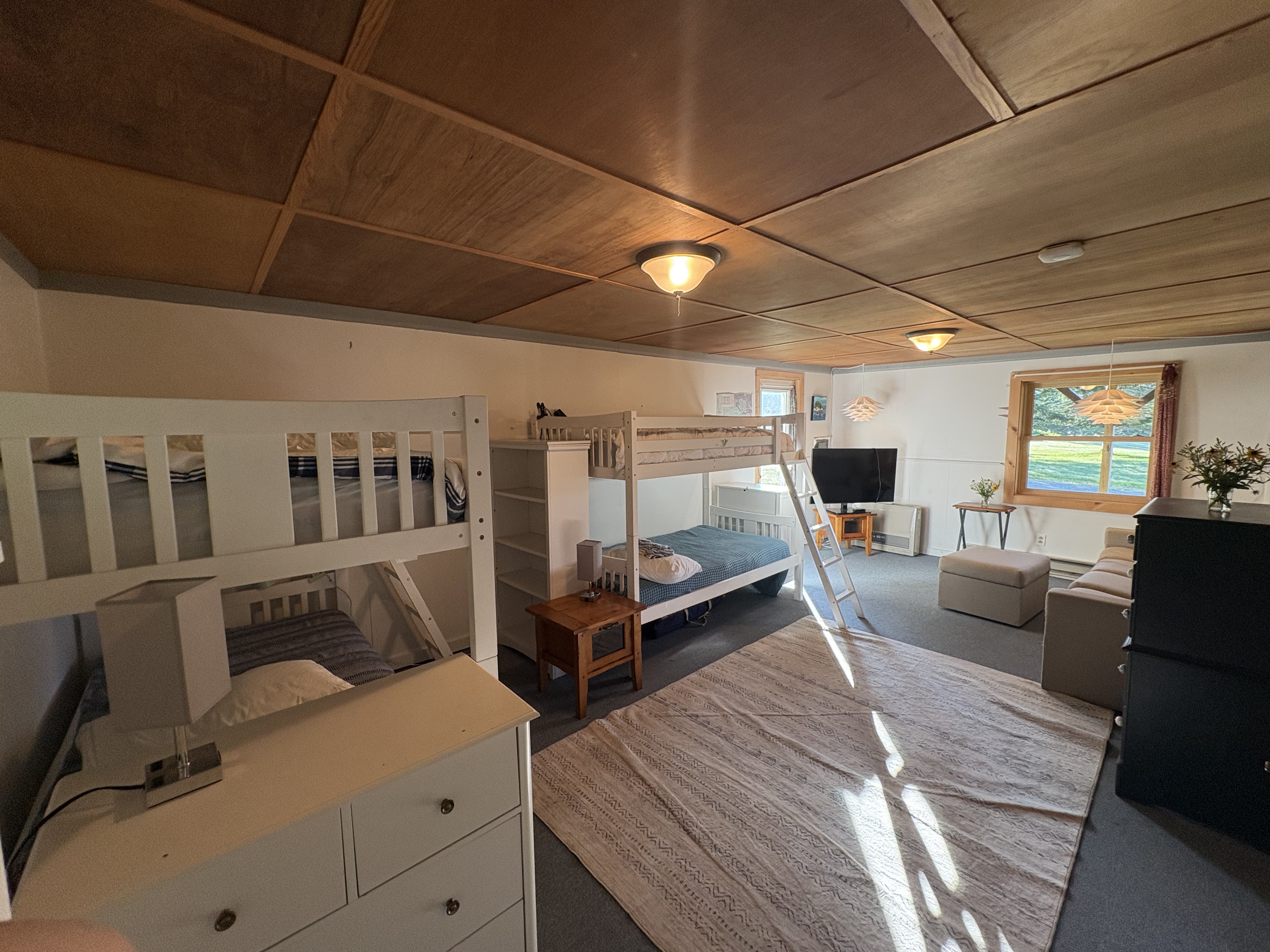 Bunk room wide view showing both bunk beds