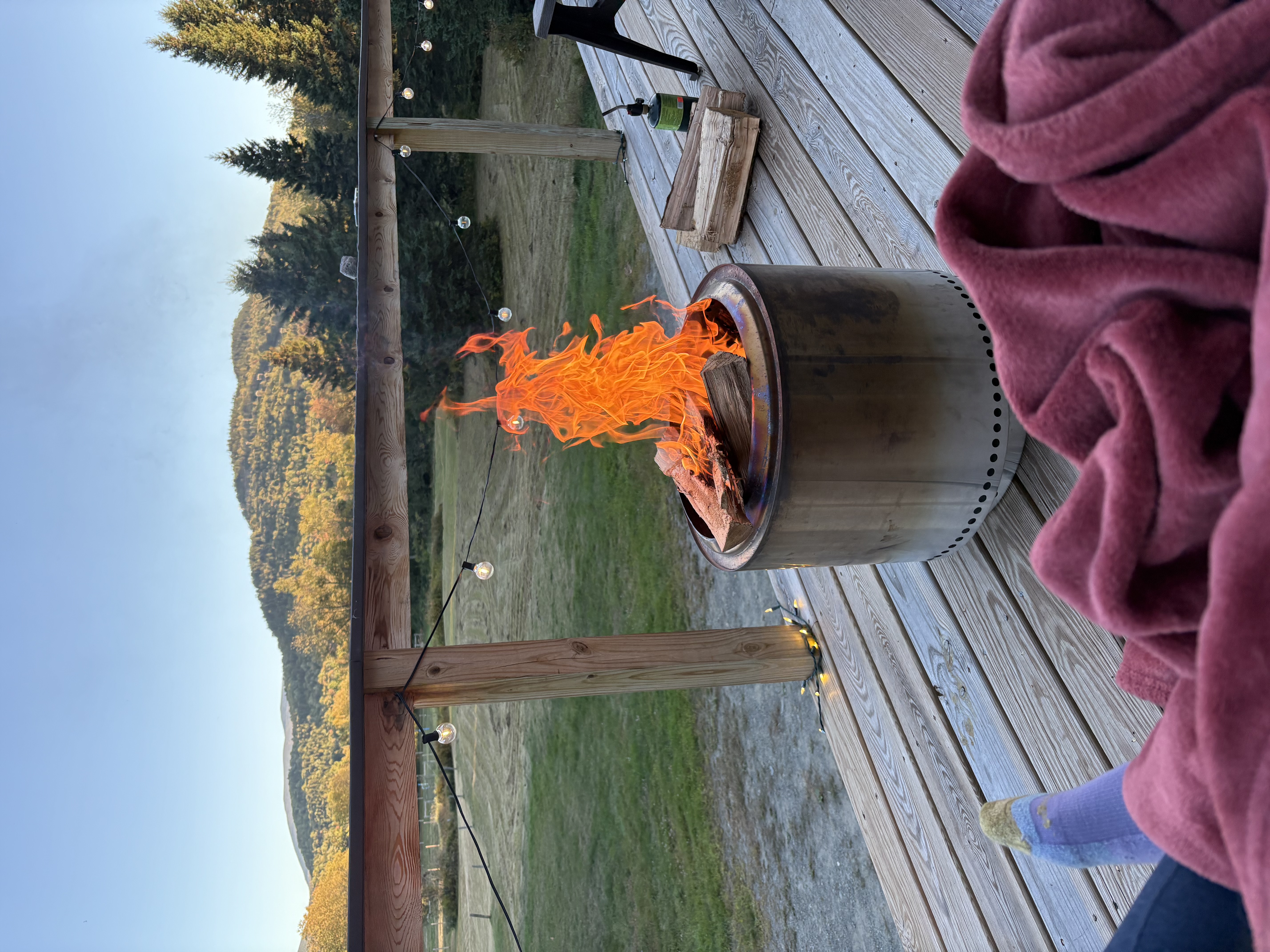 Fire pit on large deck with mountain views